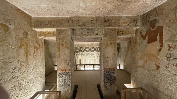 Reliefs and painted details inside a tomb near the pyramids